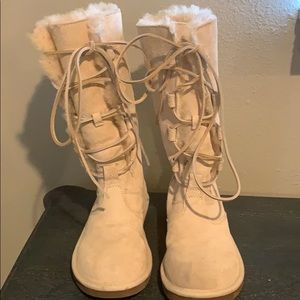 Tall, cream-colored UGG boots